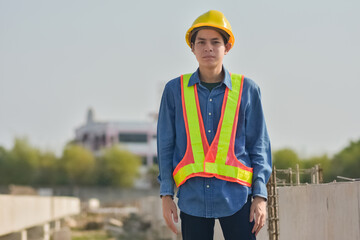 Asian man construction safety suit helmet onsite work, Asian man Engineer