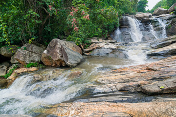Naklejka na ściany i meble Beautiful Turga waterfall having full streams of water flowing downhill amongst stones , duriing monsoon due to rain at Ayodhya pahar (hill) - at Purulia, West Bengal, India.