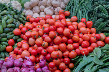 Tomato and other vegetables for sale in a market in Territy Bazar, Kolkata, West Bengal, India.