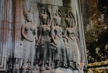 An image of a sandstone Apsara carving on a sandstone column at Angkor Wat Siem Reap, Cambodia.