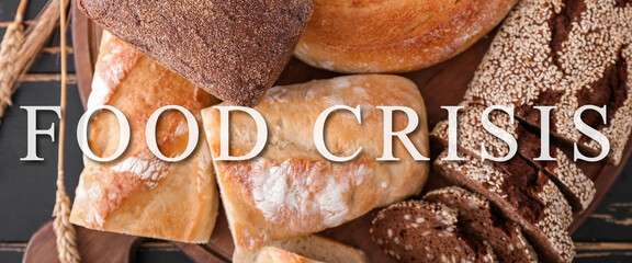 Different fresh bread on wooden background. Food crisis