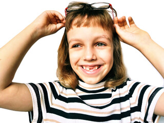 A 7-year-old Caucasian girl smiles and raises her glasses. Child ophthalmic problems. Myopia,...