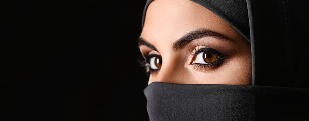 Portrait of beautiful Muslim woman on dark background with space for text, closeup