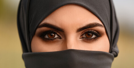 Portrait of beautiful Muslim woman outdoors, closeup
