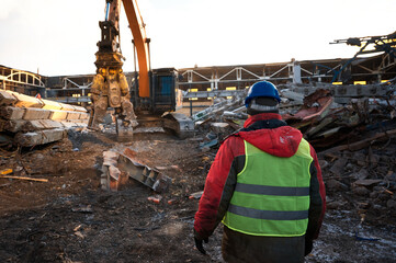 Excavator destroyer removes debris under worker control