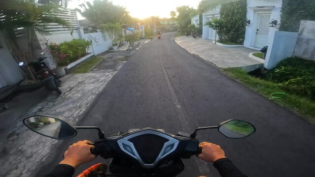 POV driving on a motorbike during sunset in Bali
