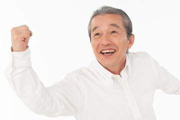 ガッツポーズのシニア男性