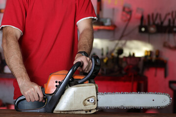 chainsaw with a person in the garage