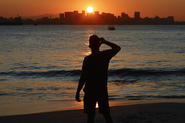 Guy admiring sunset at Niteroi, Rio de Janeiro