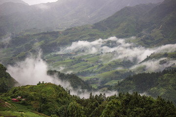 Lao Cai Province,northern Vietnam on July 14,2019:Morning fog,overcast sky and mountain ranges in Sapa.
