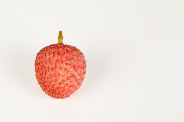 Single Litchi fruit on a white background