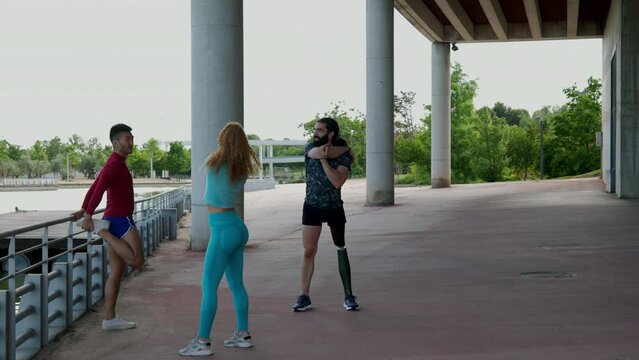 Athletic friends stretching outdoors