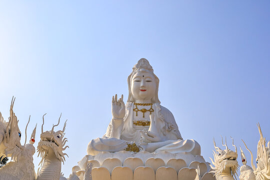 Chiang Rai Province,Northern Thailand on January 19,2020:White Guan Yin Statue and beautiful dragon staircases at Wat Huai Pla Kang.