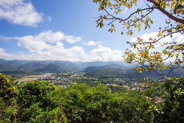 The scenery of Mae Hong Son town,Chong Kham Lake,the airport and forested hills of Burma as seen from Wat Phra That Doi Kong Mu,Mae Hong Son province,Northern Thailand.Non-English texts mean "Wat Phra