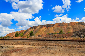 View of slag heaps of iron ore quarry. Mining industry