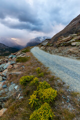 Beautiful evening light and storm cloudscape in the Swiss Alps