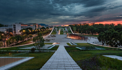 Budapest, Hungary - Illuminated rooftop garden of the Museum of Ethnography at City Park with dark clouds and colorful sky at sunset