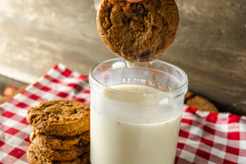dipping or wetting a cookie, making a splash. morning breakfast concept