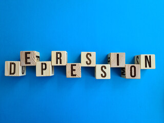 Obraz premium Depression written with wooden cubes on table