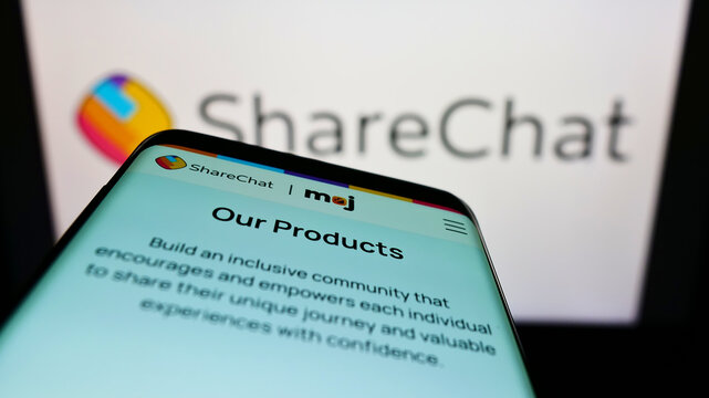 Stuttgart, Germany - 02-11-2022: Mobile phone with webpage of Indian company Mohalla Tech Pvt Ltd (ShareChat) on screen in front of logo. Focus on top-left of phone display.