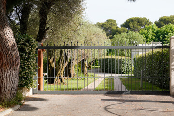 grey modern entrance portal design on home metal aluminum gate of suburb house