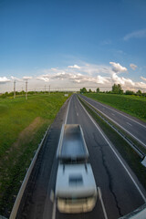 Motion blur image of a car moving along the highway