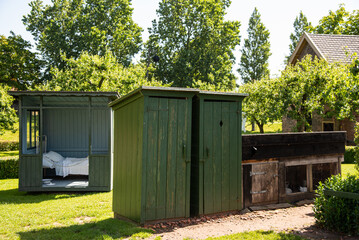 Enkhuizen, Netherlands. June 2022. An old-fashioned outdoor toilet in a garden at the Zuiderzee...