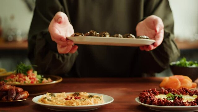 Dolma close-up, meat in grapes leaves, middle eastern national traditional food. Muslim family dinner, Ramadan, iftar. Arabian cuisine.