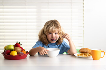 Little child boy having healthy breakfast. Kids nutrition and development. Hunger, appetite concept. Eating vegetables by child make them healthier.