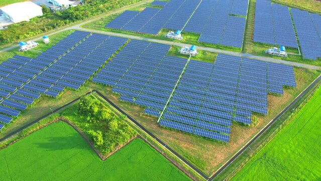 Aerial shot of Solar Power Station at morning, Renewable green energy and electrical technology. Clean energy industry in Thailand. 4k drone footage.
