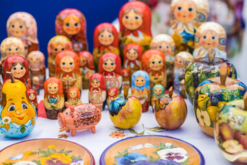 A brightly colored set of wooden dolls and other figures laying dolls. Traditional handmade toys...