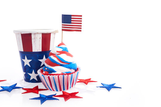 American independence day, celebration and holidays concept - cupcake in disposable tableware and stars.