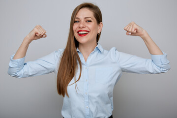 Woman power concept with smiling business woman bending her arms, isolated female portrait.