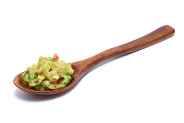 Spoon full of guacamole Mexican dip sauce isolated on white background