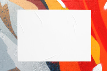 Closeup of colorful orange red beige gray blue painted urban wall texture with wrinkled glued...