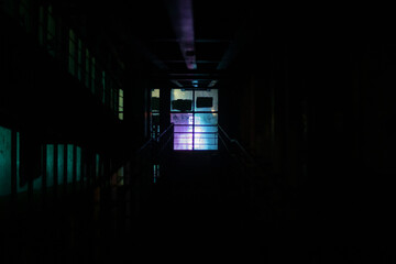 Window light in dark. Neon glow in night building.