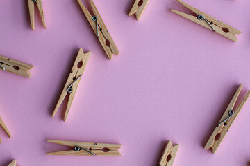 Set of decorative clothespins on a pink background - 512930211