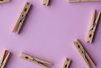 Set of decorative clothespins on a pink background - 512930237