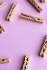 Set of decorative clothespins on a pink background - 512930238