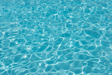 Swimming pool water ripples background, clean blue seiche waves in a spacious outdoor piscina,...