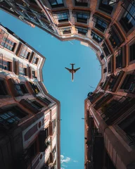Deurstickers vliegtuig uitzicht op de stad © Robby
