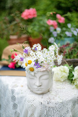 summer flowers in the Buddha vase
