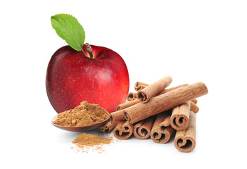 Fresh ripe apple, aromatic cinnamon sticks and powder on white background