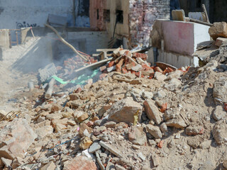 Ruin structure, debris scattered scene in rural village in India. Wreckages of building