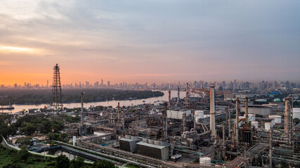 Oil and gas refinery plant form industry zone at night, Aerial view oil and gas Industrial petrochemical fuel power and energy.
