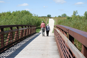 Two people enjoying walking in James Pate Philip State Park, Bartlett, Illinois, USA.