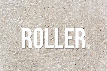 ROLLER - word on concrete background. Cement floor, wall.