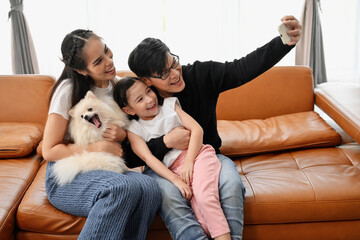 happy Asian family Having fun playing games at home. Concept spending time with family