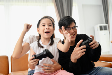 happy Asian family Having fun playing games at home. Concept spending time with family