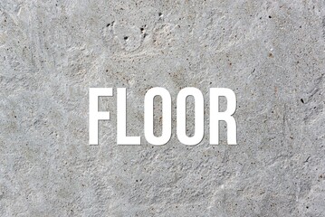 FLOOR - word on concrete background. Cement floor, wall.